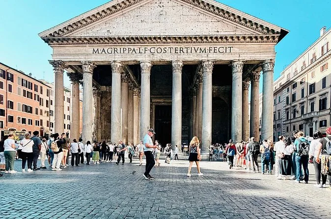 The Pantheon facade with a queue of visitors in front
