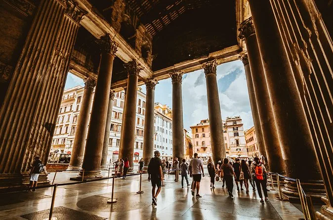 Looking out from inside the shaded Pantheon portico towards the piazza